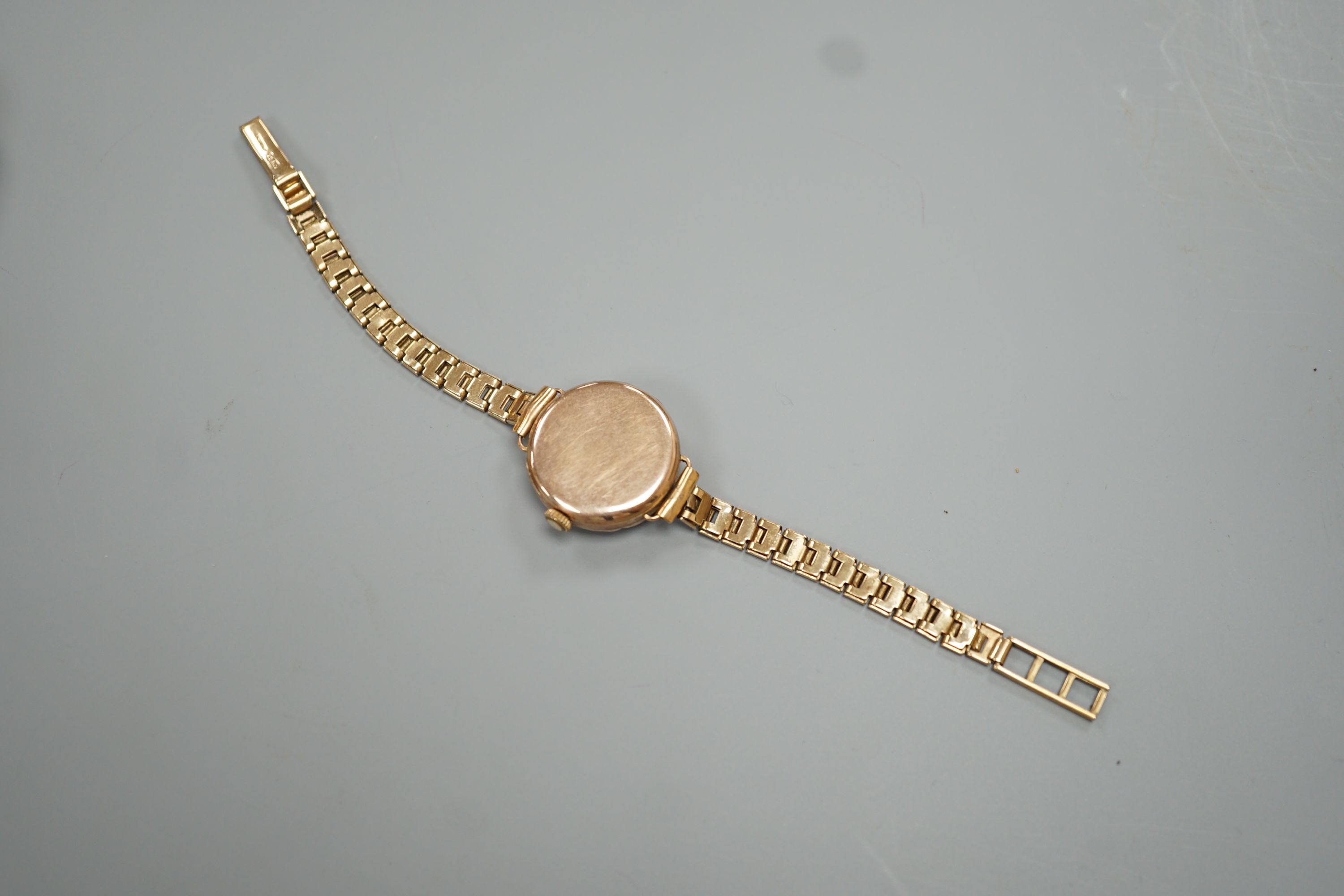 A lady's early 20th century 9ct gold Rolex manual wind wrist watch, on an associated 9ct gold bracelet
